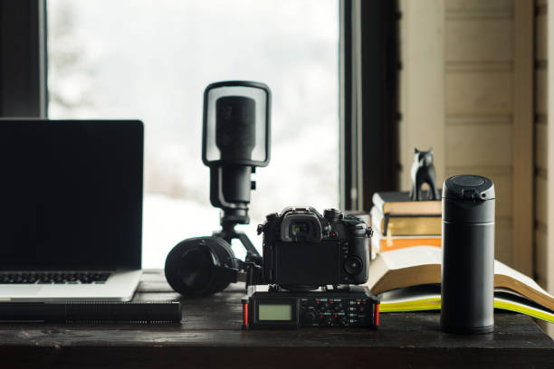 istock Audio / Video editing workspace office with mountain view. Photography and videography equipment. 918498414