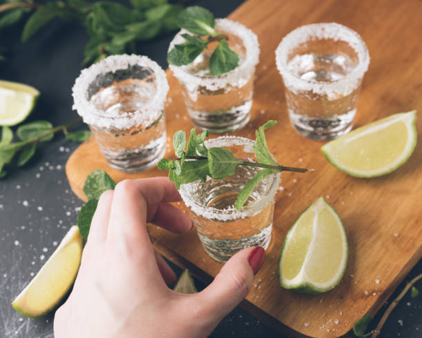 istock Alcohol shots on wooden tray. 918501596