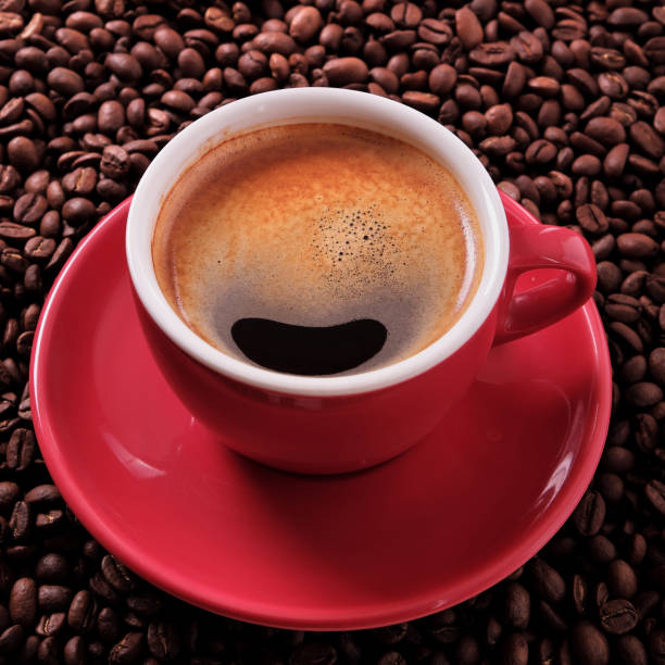 istock Red coffee cup with espresso and roasted beans 918502030