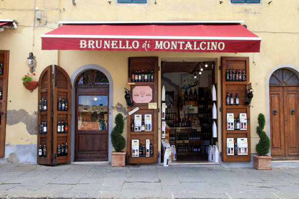 Entrance of traditional wine shop in Montalcino, Val d'Orcia, Tuscany, Italy. Montalcino, Italy - July 20, 2017: Entrance of traditional wine shop in Montalcino, Val d'Orcia, Tuscany, Italy. The town is famous for its Brunello di Montalcino wine. val stock pictures, royalty-free photos & images