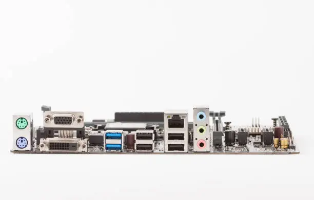 Photo of Ports of new, modern computer motherboard, isolated on white background