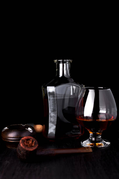 istock Glass of whiskey with smoking cigar. 918509794