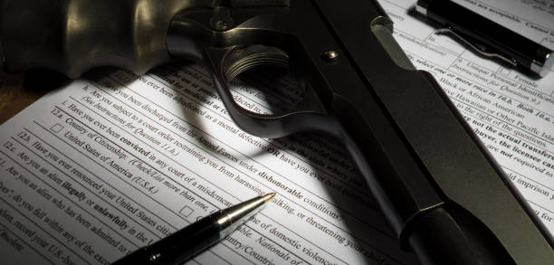 istock Handgun on the dishonorable discharge line in the NICS background check 918512504