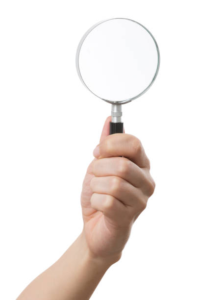 istock Isolated shot of holding a magnifying glass on white background 918515668