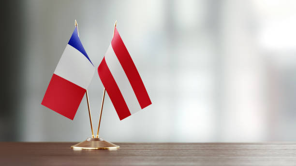 istock French And Austrian Flag Pair On A Desk Over Defocused Background 918515752