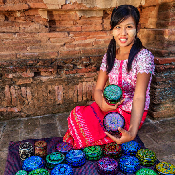 istock Young Burmese girl selling a lacquerware in Bagan, Myanmar 918516952