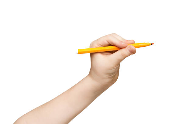 istock Kid hand holding felt-tip pen isolated on white 918517572