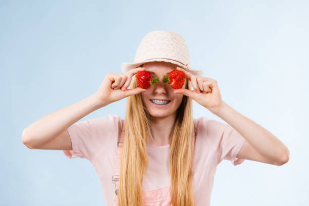 istock Happy woman holding strawberries 918520878