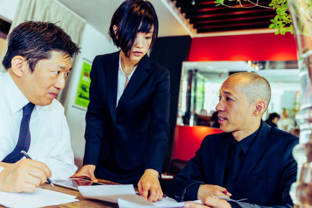 istock Executives making critical discussions regarding the future of the restaurant 918520910