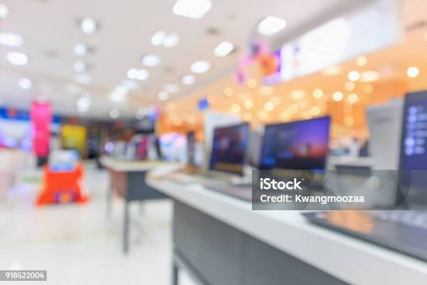 Computer Notebook Laptop On Table At Electronics Store In Shopping Mall Abstract Blur Defocused Background Stock Photo - Download Image Now