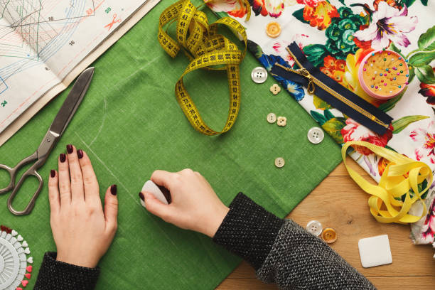 istock Top view on fashion designer working at messy table 918522162