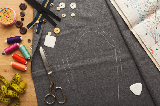 Workspace of fashion designer, top view