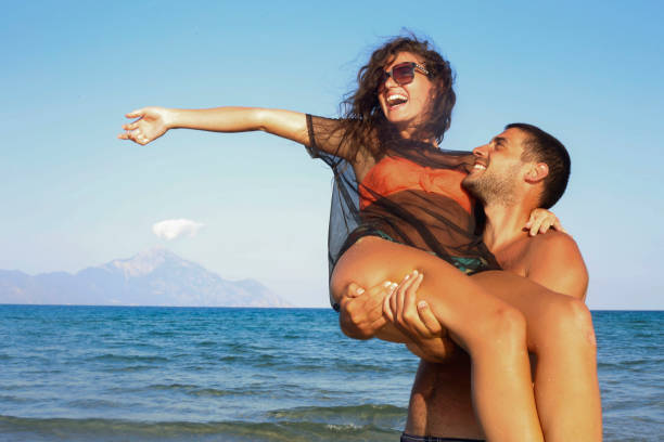 Attractive young couple on tropical beach
