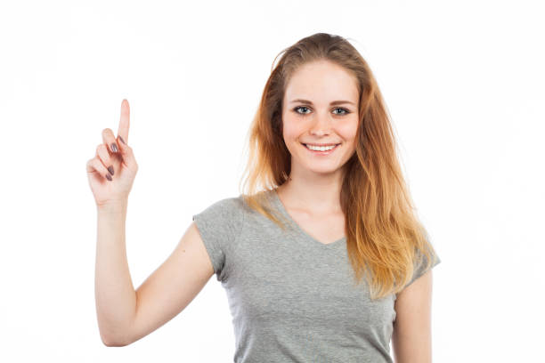 istock Young woman pointing up 918525078