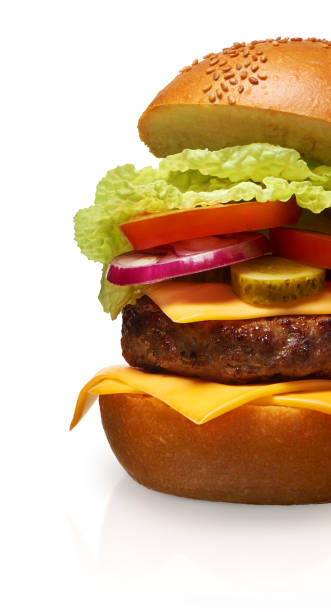 istock Hamburger with cheese, pickles, tomato, onions and lettuce 918529156
