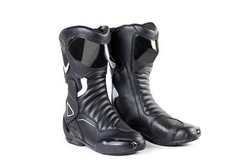 Black and white sports motorcycle boots. Isolated on a white background.