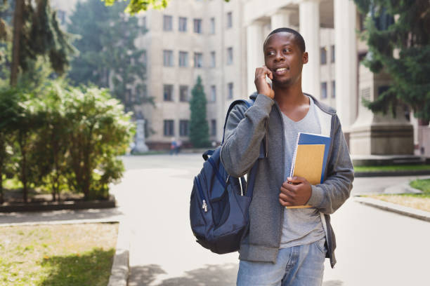 istock Happy african-american student talking on smartphone in campus 918535450