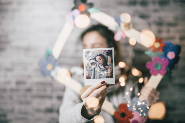 istock Artist with polaroid picture 918536896
