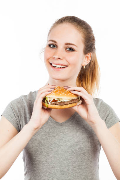 istock Young woman with a hamburger 918537086