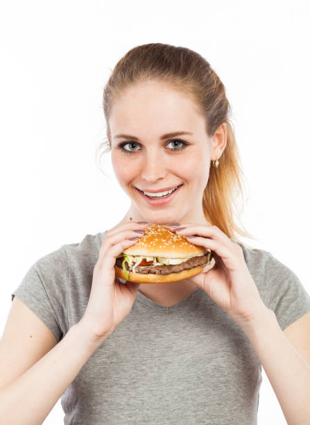 istock Girl with a burger 918537208