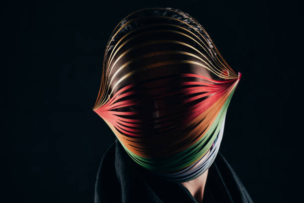 woman with colored quilling paper on head isolated on black