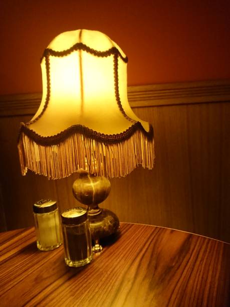 istock Retro styled lamp on wooden table 918548584