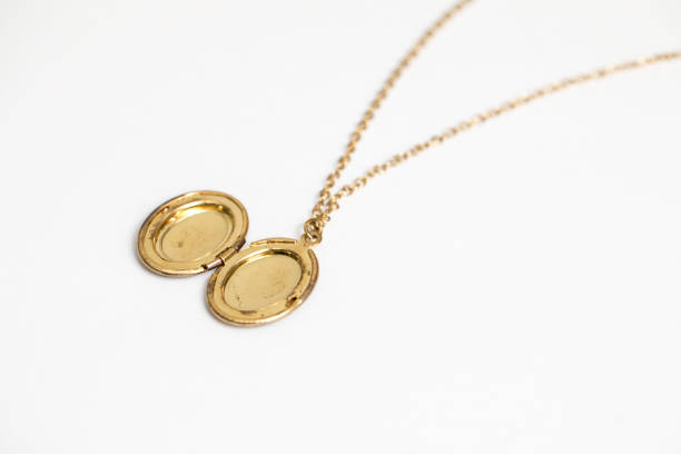 Female hand holding a gold medallion 