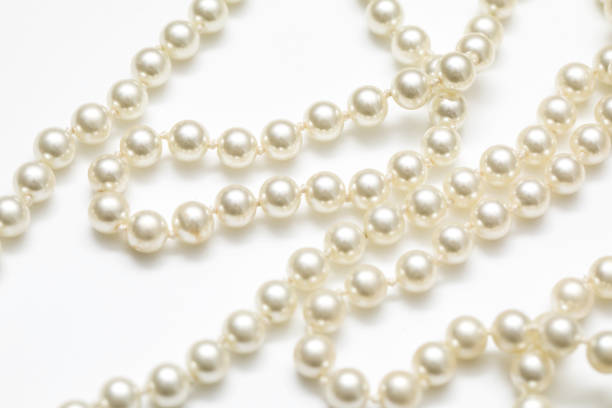 istock Pearls White Background On A Necklace 918557688