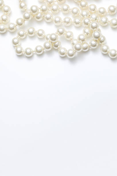 istock Pearls White Background On A Necklace 918557810