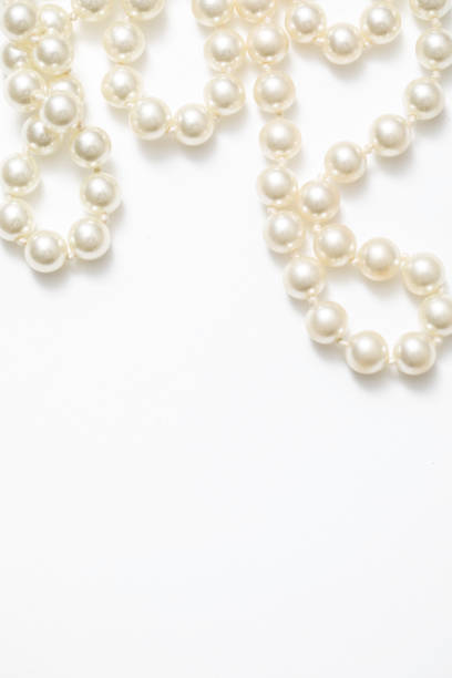 istock Pearls White Background On A Necklace 918557850