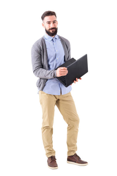 istock Happy smiling smart casual man holding laptop and looking at camera. 918561950