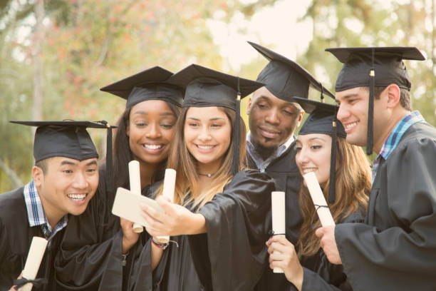 istock College student friends take selfie after graduation ceremony. 918564850