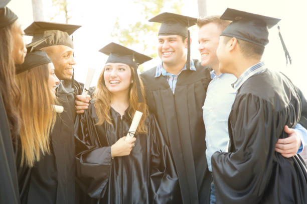 istock College students and friends after graduation ceremony. 918565610