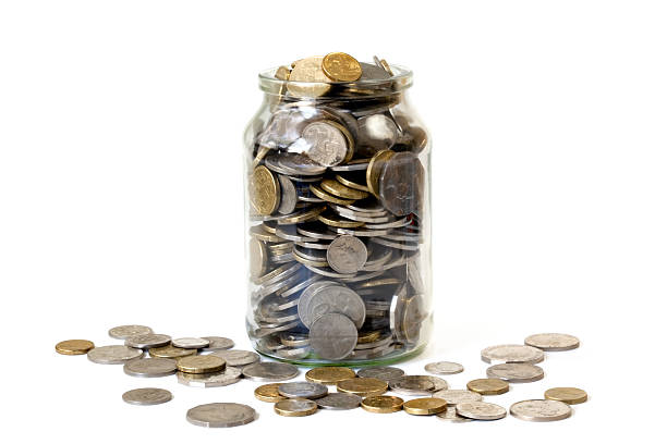 istock Overflowing Jar of Coins 91856778