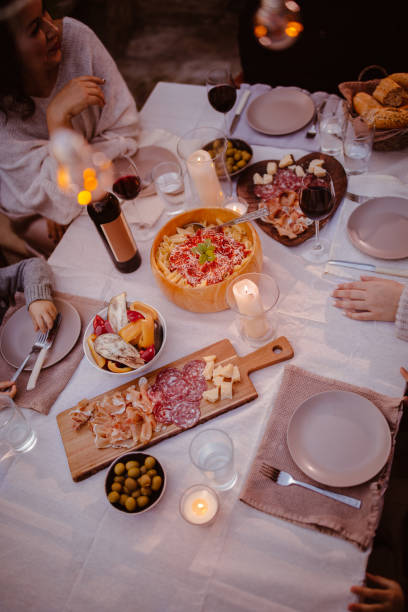 istock Top view of family at traditional rustic mediterranean dinner table 918569042
