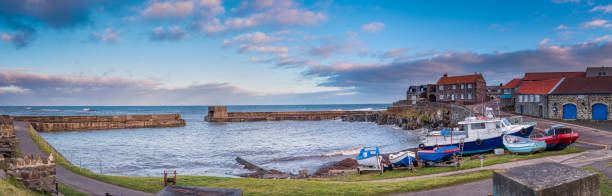 Craster is a small fishing village on the Northumberland coast, with a small harbour and views to the ruins of Dunstanburgh Castle