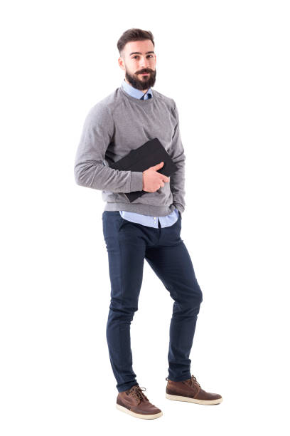 istock Handsome relaxed stylish bearded teacher with notebook looking at camera 918569524