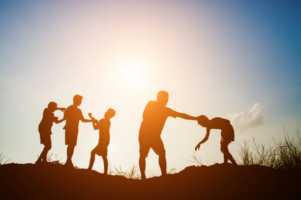 istock Children playing on summer sunset happy time 918569624