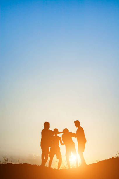 istock Children playing on summer sunset happy time 918569654