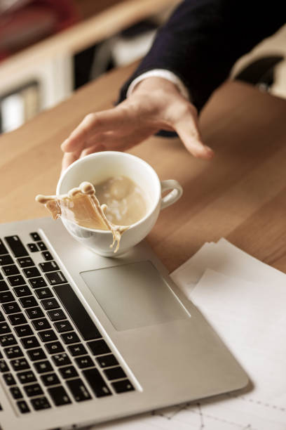 istock Coffee in white cup spilling on the table in the morning working day at office table 918576134
