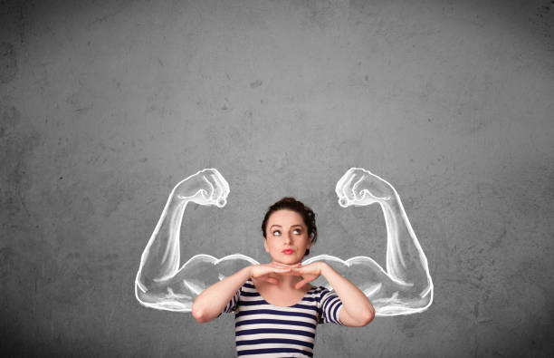 istock Young woman with strong muscled arms 918576514