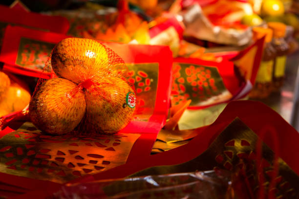 Thailand Bangkok - January 29 2018 : Three Tangerines with silver and gold papers is component in worshiping Chinese god,Chinese new year,Wat Lengnoeiyi,Yaowarat