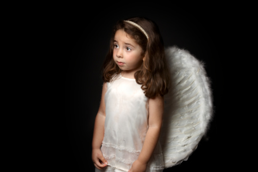 Portrait of child on background of white wings