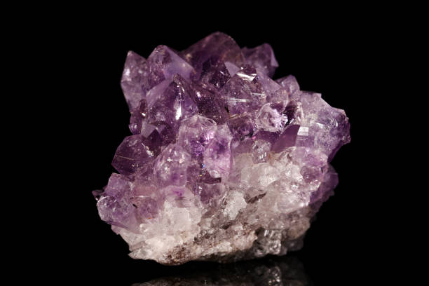 istock Amethyst quartz mineral on black background 918579866