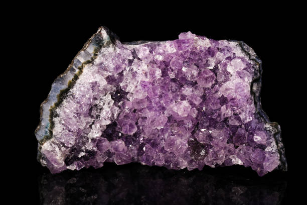 istock Amethyst quartz mineral on black background 918579870
