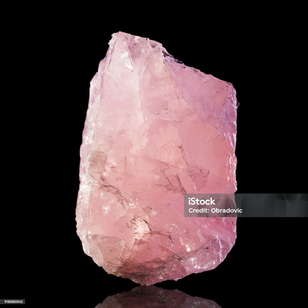 Pink Rose Quartz Mineral Specimen on black background Rose quartz isolated on black background. Rose Quartz Stock Photo