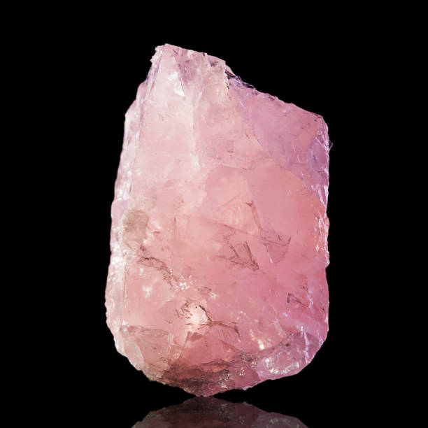 Pink Rose Quartz Mineral Specimen on black background Rose quartz isolated on black background. geode photos stock pictures, royalty-free photos & images