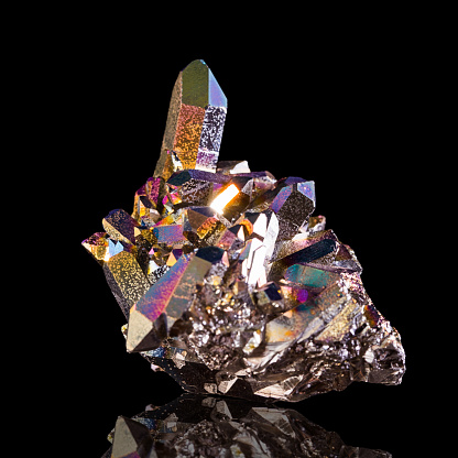 Aura quartz geode isolated on black background.