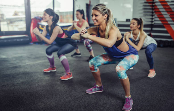 Group of athlete women exercising at the gym. Fitness women exercising at gym. Group of athlete women exercising at the gym. Fitness women exercising at gym. aerobics photos stock pictures, royalty-free photos & images