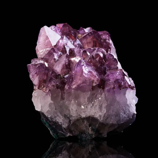 Amethyst geode isolated on black background.